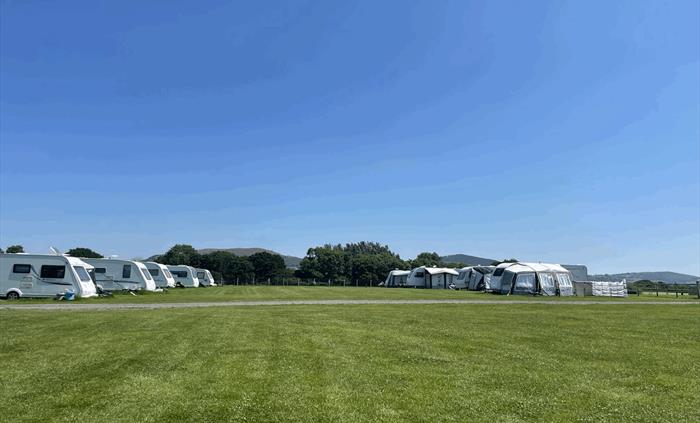 spacious pitches for caravans with 360 degrees of mountains and views